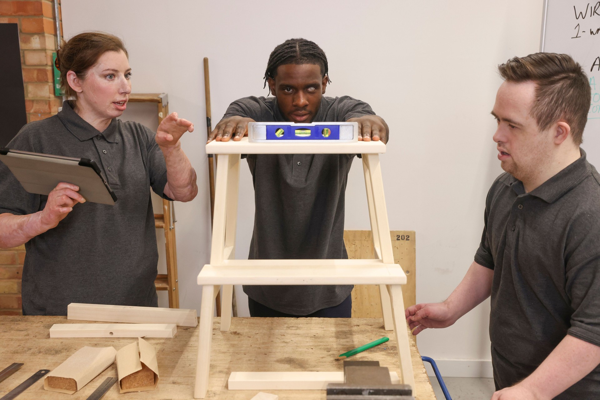 Disabled men and woman at workshop