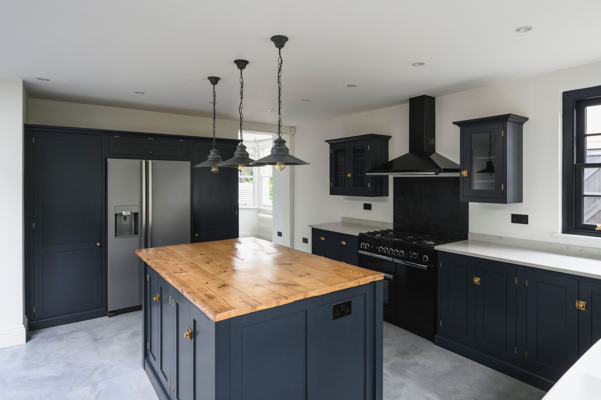 Stylish domestic kitchen with black accented cabinetry